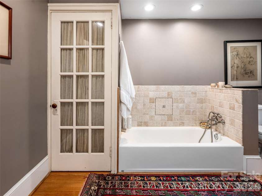 352 Justice Ridge Road, Candler, NC 28715.  MLS# CAR4357207, YatesRealty ID 6458. Unwind in the cast iron soaking tub. 