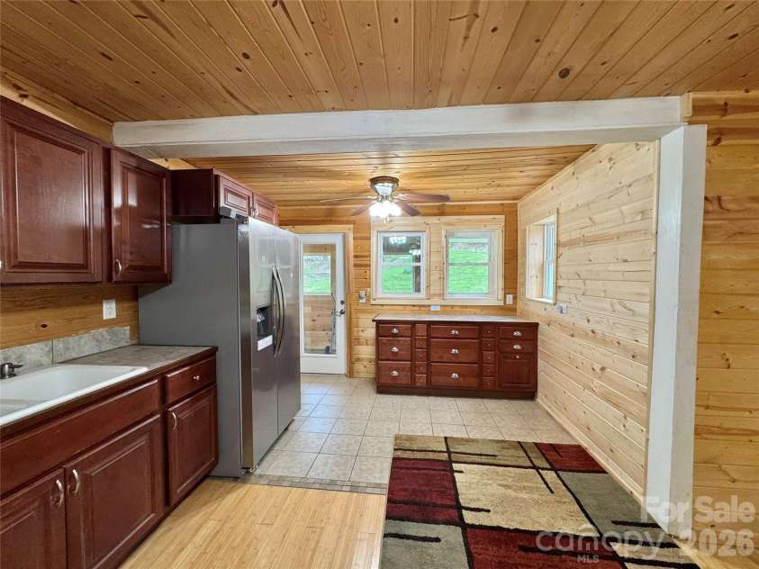 55 Summit View Drive, Marshall, NC 28753.  MLS# CAR4323108, YatesRealty ID 6462. Kitchen toward sunroom