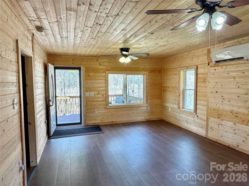 55 Summit View Drive, Marshall, NC 28753.  MLS# CAR4323108, YatesRealty ID 6462. Livingroom toward front door entrance with main