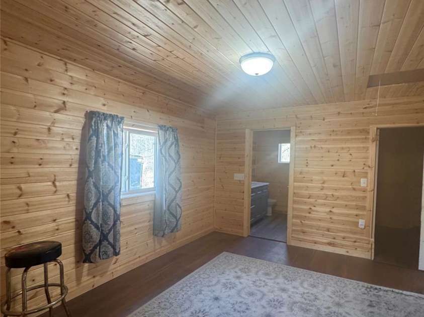 55 Summit View Drive, Marshall, NC 28753.  MLS# CAR4323108, YatesRealty ID 6462. Main bedroom looking toward bath