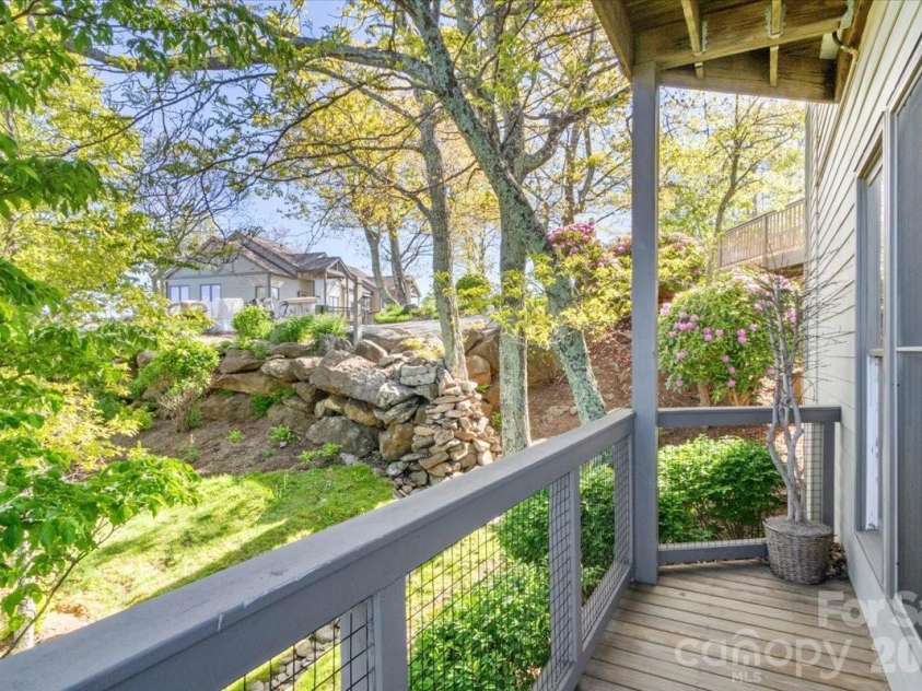 140 Slickrock Road, Burnsville, NC 28714.  MLS# CAR4369960, YatesRealty ID 6465. DECK OFF KITCHEN / DINING AREA
