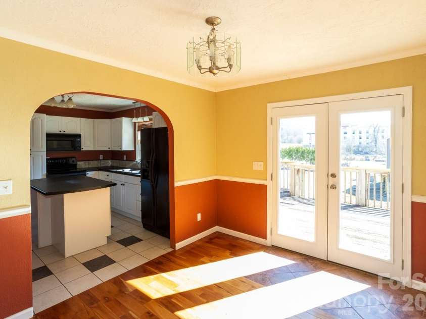 56 Vance Avenue, Black Mountain, NC 28711.  MLS# CAR4340942, YatesRealty ID 6473. Dining while enjoying the lovely long range views, upper deck access.