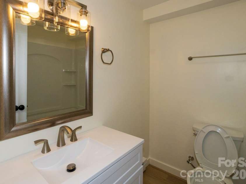 56 Vance Avenue, Black Mountain, NC 28711.  MLS# CAR4340942, YatesRealty ID 6473. Downstairs bath