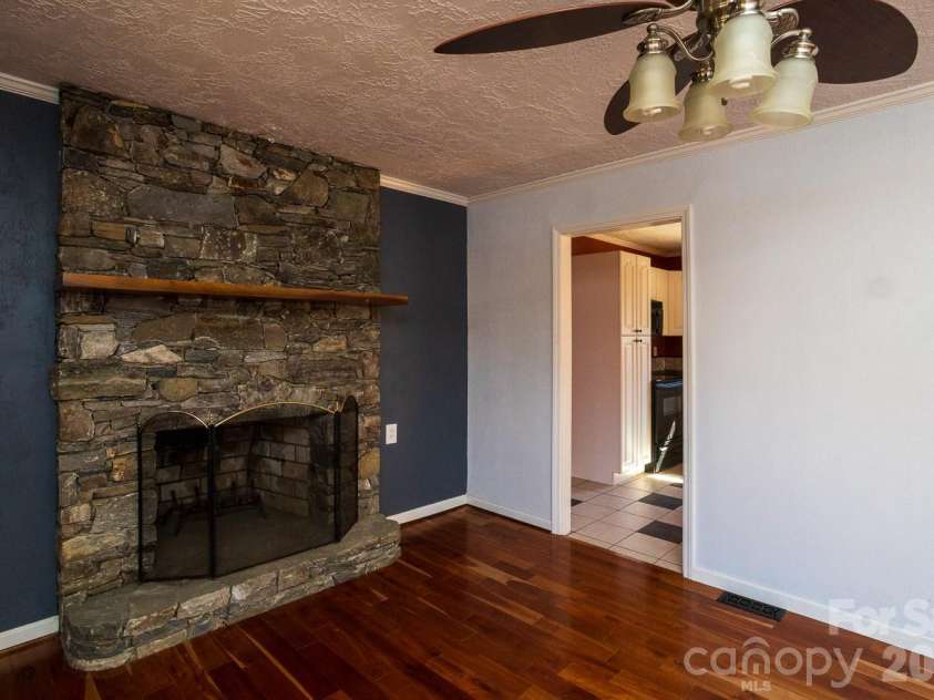 56 Vance Avenue, Black Mountain, NC 28711.  MLS# CAR4340942, YatesRealty ID 6473. Fireplace in front room