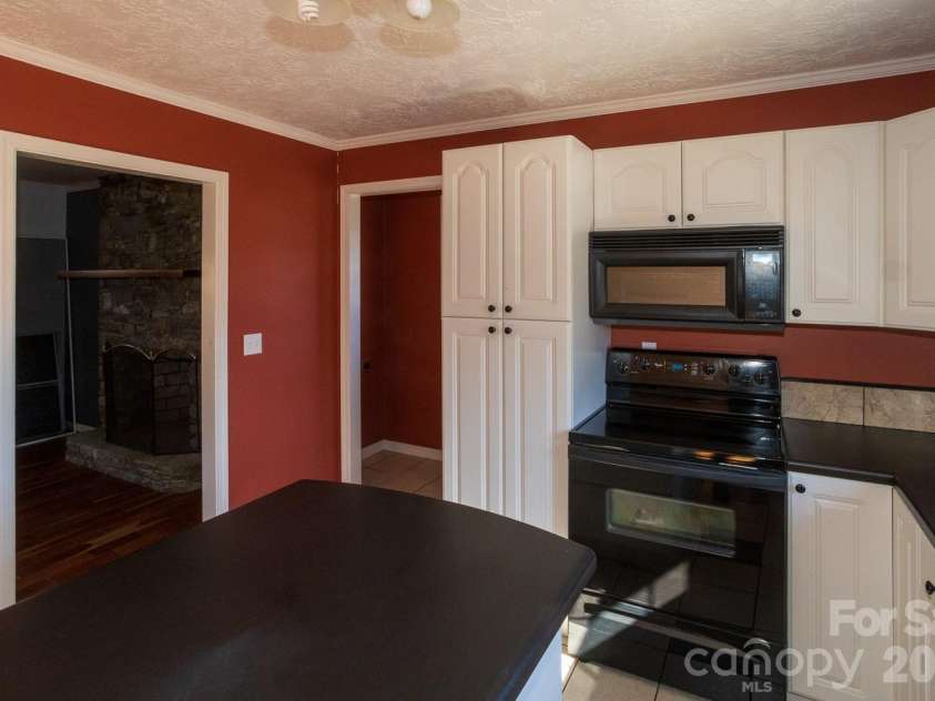 56 Vance Avenue, Black Mountain, NC 28711.  MLS# CAR4340942, YatesRealty ID 6473. Laundry room on left, lots of cabinet space!