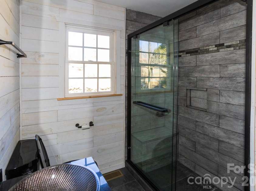 56 Vance Avenue, Black Mountain, NC 28711.  MLS# CAR4340942, YatesRealty ID 6473. Stylish bath 