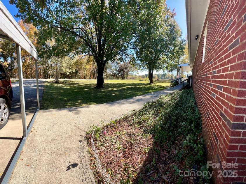 240 Hamrick Road, Mooresboro, NC 28114.  MLS# CAR4319970, YatesRealty ID 6486. WALKWAY FROM DRIVWAY