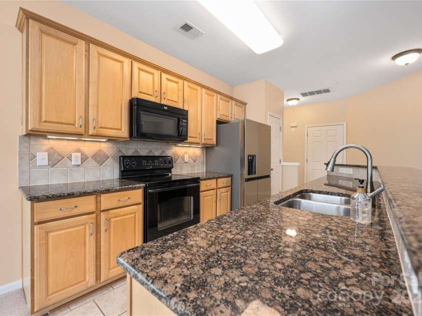 11544 Costigan Lane, Charlotte, NC 28277.  MLS# CAR4245194, YatesRealty ID 6494. Kitchen view to front door