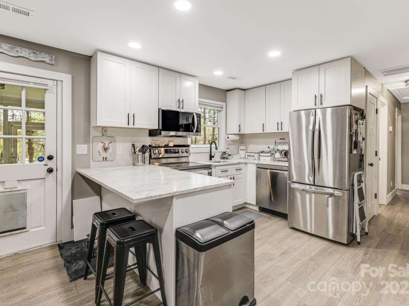 57 Maplewood Knoll Drive, East Flat Rock, NC 28726.  MLS# CAR4239967, YatesRealty ID 6497. Breakfast bar.
