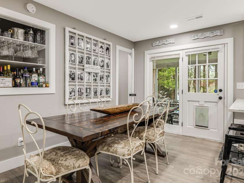 57 Maplewood Knoll Drive, East Flat Rock, NC 28726.  MLS# CAR4239967, YatesRealty ID 6497. Dining space with built-in shelving.