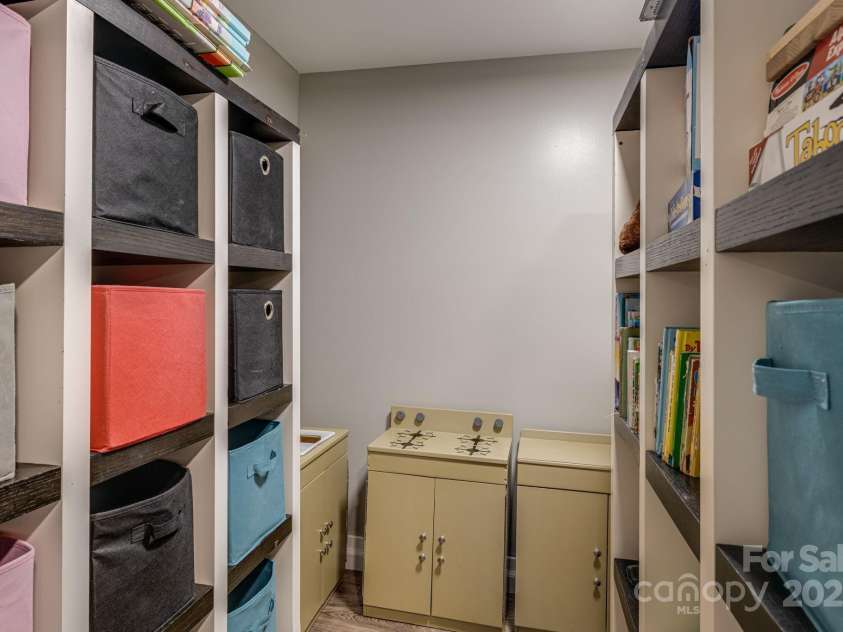 57 Maplewood Knoll Drive, East Flat Rock, NC 28726.  MLS# CAR4239967, YatesRealty ID 6497. Lower level storage closet.