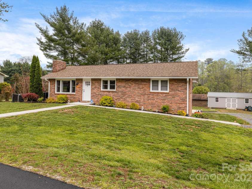 57 Maplewood Knoll Drive, East Flat Rock, NC 28726.  MLS# CAR4239967, YatesRealty ID 6497. Newer extra large storage unit conveys!