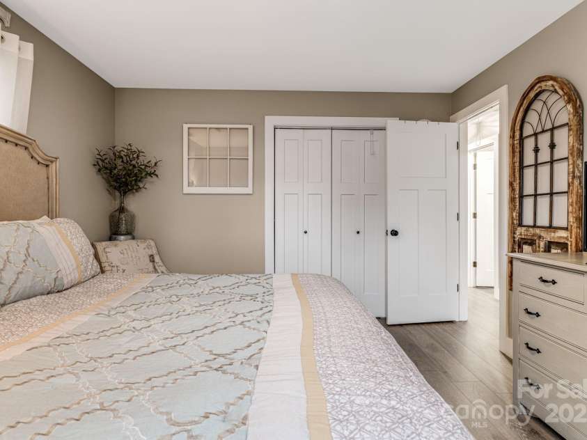 57 Maplewood Knoll Drive, East Flat Rock, NC 28726.  MLS# CAR4239967, YatesRealty ID 6497. Primary bedroom and closet.