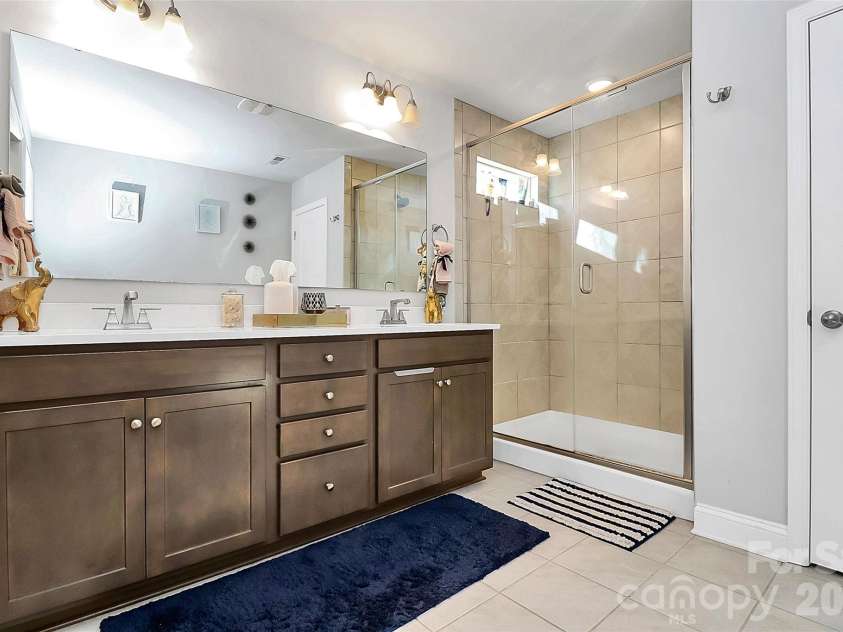 238 Johnston Drive, Pineville, NC 28134.  MLS# CAR4320235, YatesRealty ID 6501. Dual vanity and shower in Primary bathroom