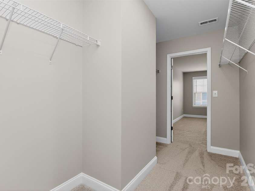 238 Johnston Drive, Pineville, NC 28134.  MLS# CAR4320235, YatesRealty ID 6501. Oversized walk in closet in primary bedroom