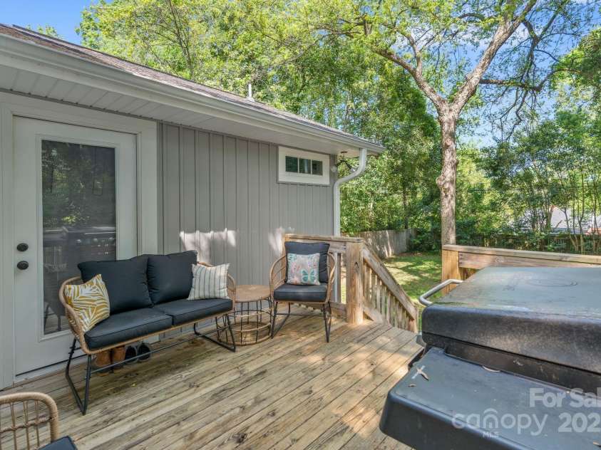 2117 Camp Greene Street, Charlotte, NC 28208.  MLS# CAR4241188, YatesRealty ID 6504. Relax on the private back deck.  Access from both the primary bedroom and back entrance