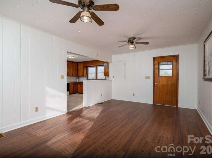 897 Calloway Road, Lincolnton, NC 28092.  MLS# CAR4329478, YatesRealty ID 6504. Den looking into the kitchen