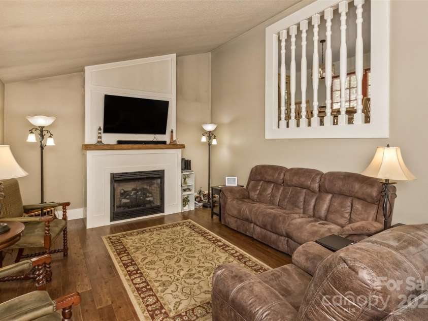 3474 Crestwood Drive, Morganton, NC 28655.  MLS# CAR4245149, YatesRealty ID 6508. Living room w/gas logs fireplace and vaulted ceiling.