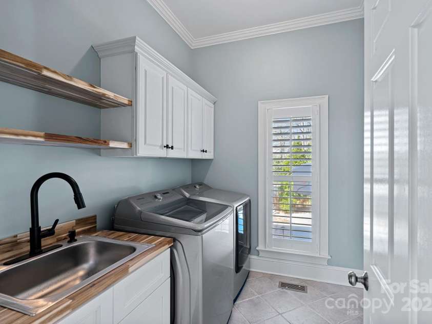 115 Jade Spring Court, Mooresville, NC 28117.  MLS# CAR4239808, YatesRealty ID 6512. Downstairs Laundry Room