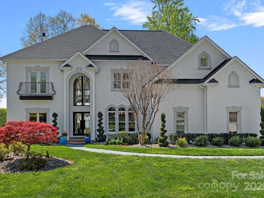 115 Jade Spring Court, Mooresville, NC 28117.  MLS# CAR4239808, YatesRealty ID 6512. Freshly Painted White Brick and Gorgeous Landscape