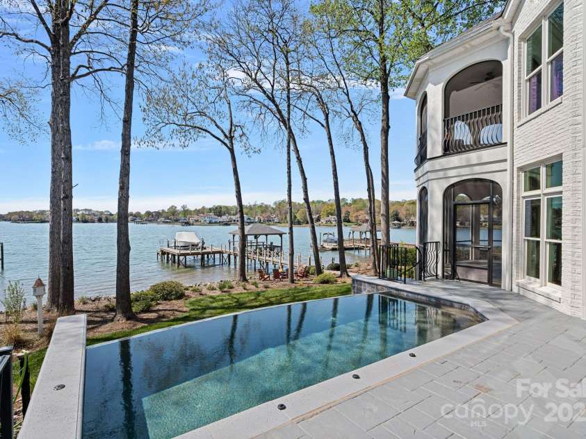 115 Jade Spring Court, Mooresville, NC 28117.  MLS# CAR4239808, YatesRealty ID 6512. Pool Looking Out at the Lake
