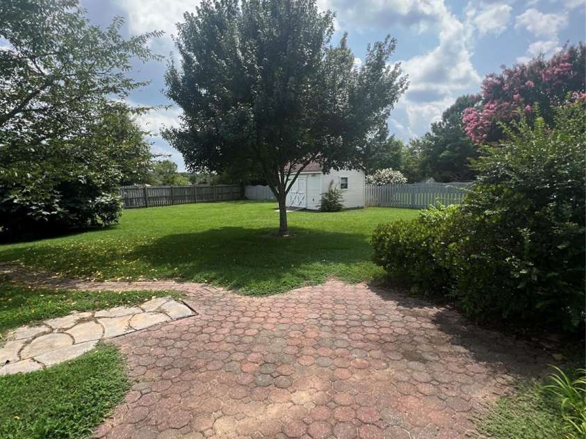 4817 Mossy Cup Lane, Monroe, NC 28110.  MLS# CAR4165542, YatesRealty ID 6519. Patio overlooking large level fenced yard