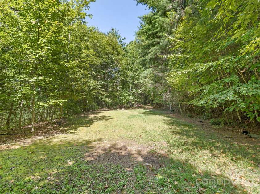 658 Johnson Road, Brevard, NC 28712.  MLS# CAR4300237, YatesRealty ID 652. Additional parcel included with level build spot