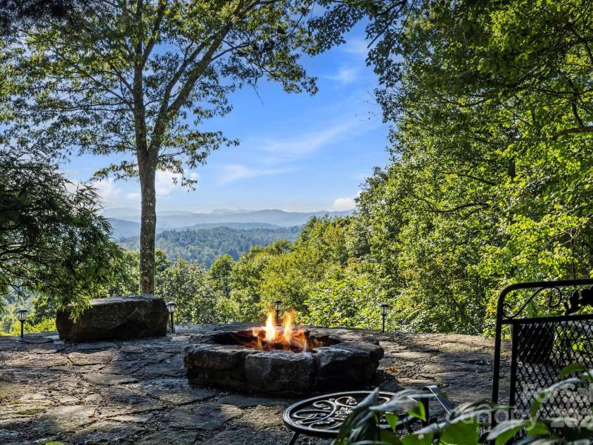 658 Johnson Road, Brevard, NC 28712.  MLS# CAR4300237, YatesRealty ID 652. Custom stone patio and firepit