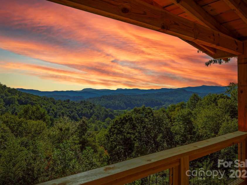 658 Johnson Road, Brevard, NC 28712.  MLS# CAR4300237, YatesRealty ID 652. Magnificently painted skies over the mountains