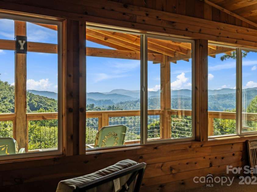 658 Johnson Road, Brevard, NC 28712.  MLS# CAR4300237, YatesRealty ID 652. Sunroom offers custom windows to capture the spectacular views