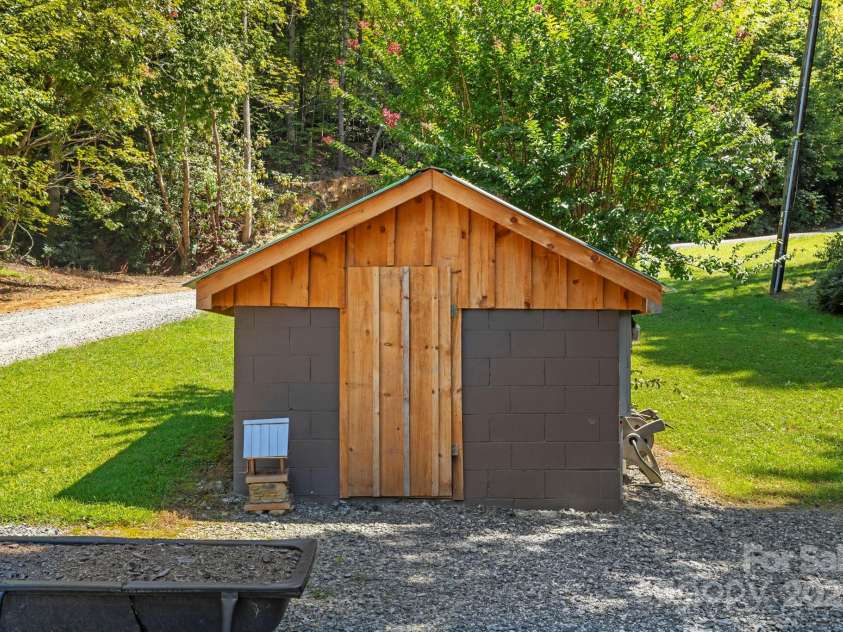 658 Johnson Road, Brevard, NC 28712.  MLS# CAR4300237, YatesRealty ID 652. Well installed on additional included parcel