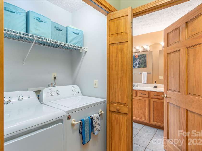 1429 Country Club Drive, Maggie Valley, NC 28751.  MLS# CAR4247939, YatesRealty ID 6536. Laundry in Primary BR