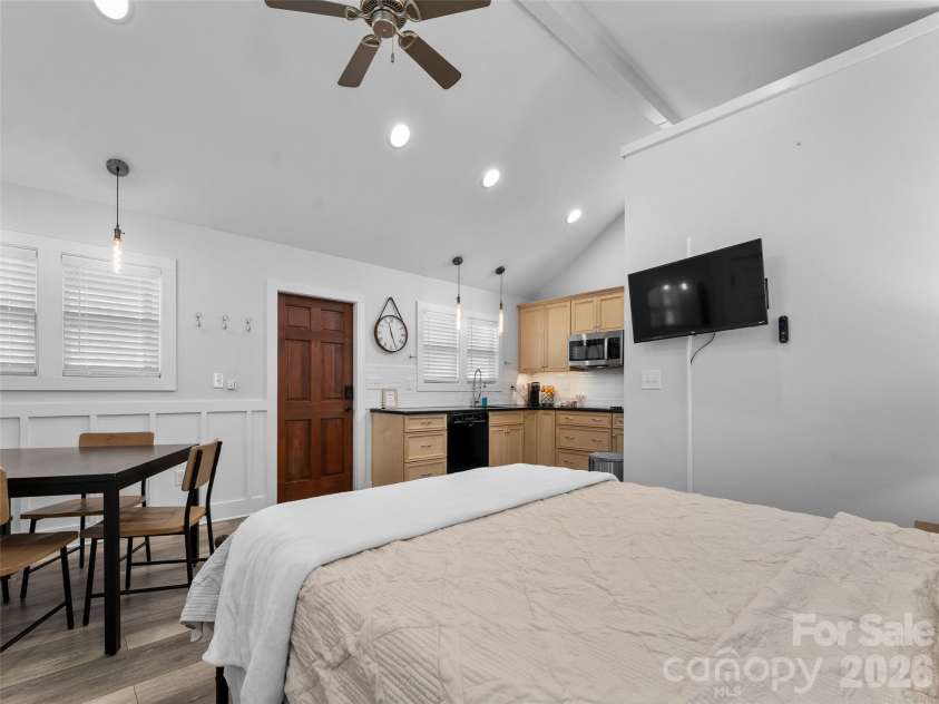 175 Duckworth Avenue, Brevard, NC 28712.  MLS# CAR4361938, YatesRealty ID 6539. Unit A - Sleeping Area, Dining Area, Kitchen, and Entrance