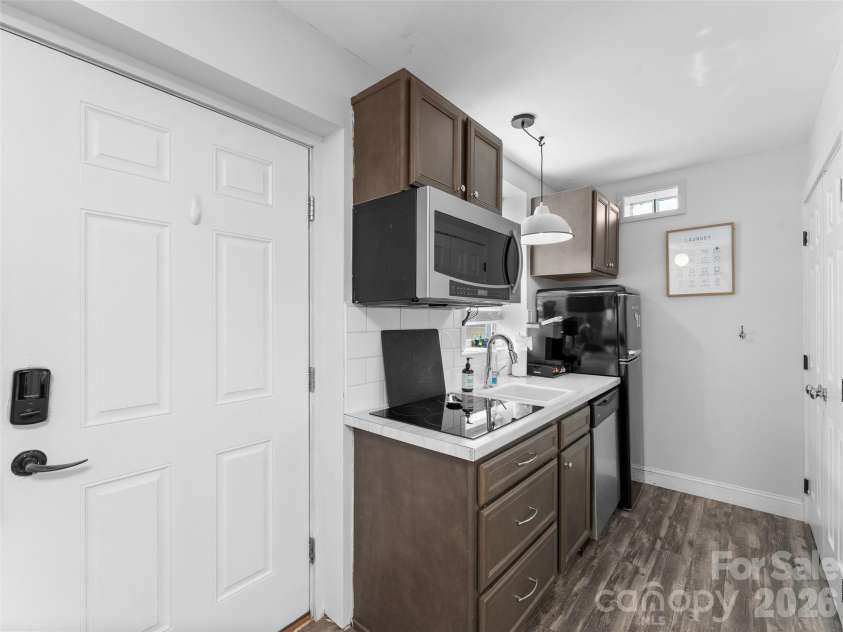 175 Duckworth Avenue, Brevard, NC 28712.  MLS# CAR4361938, YatesRealty ID 6539. Unit B - Entrance and Kitchen