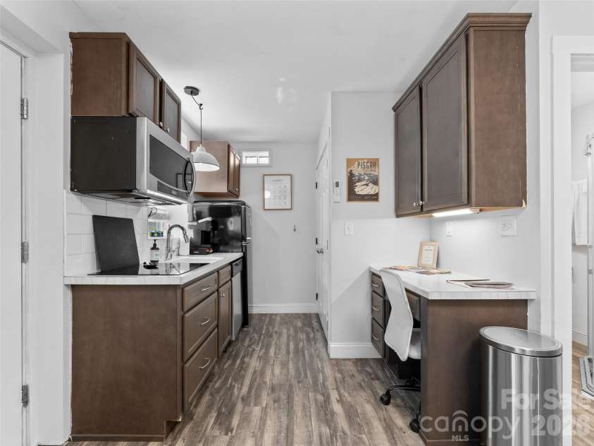175 Duckworth Avenue, Brevard, NC 28712.  MLS# CAR4361938, YatesRealty ID 6539. Unit B - Kitchen, Washer/Dryer, and Workspace