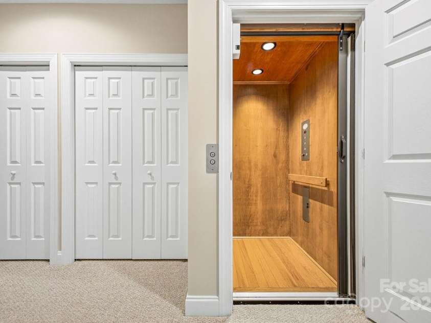38 Sweetwater Oaks Drive, Fletcher, NC 28732.  MLS# CAR4331629, YatesRealty ID 654. Elevator at Lower level