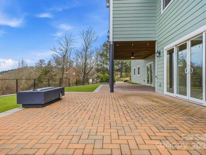 38 Sweetwater Oaks Drive, Fletcher, NC 28732.  MLS# CAR4331629, YatesRealty ID 654. Lower level patio and turf