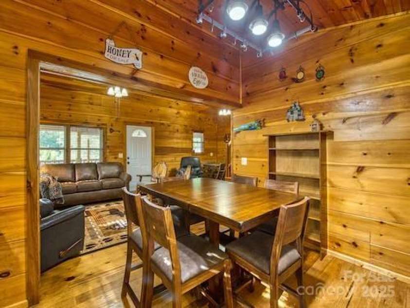 233 Rocky Top Road, Maggie Valley, NC 28751.  MLS# CAR4247300, YatesRealty ID 6543. Dining area & living room