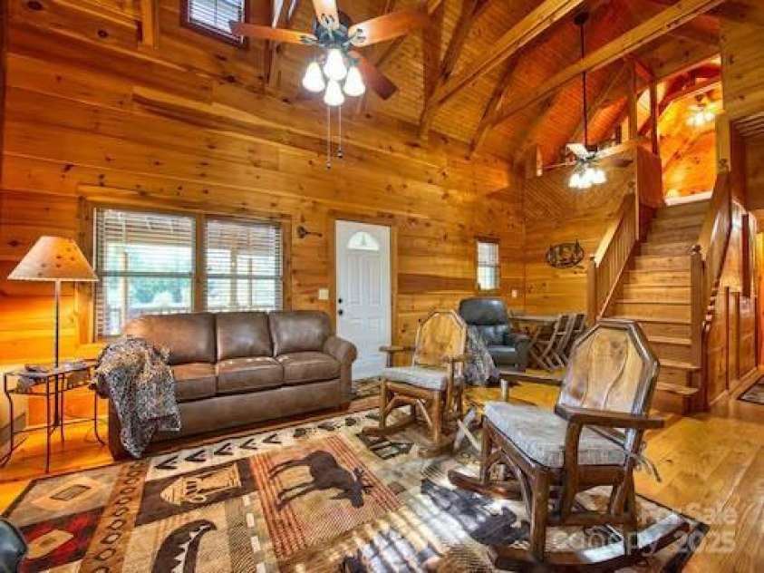 233 Rocky Top Road, Maggie Valley, NC 28751.  MLS# CAR4247300, YatesRealty ID 6543. Living room & access to upstairs