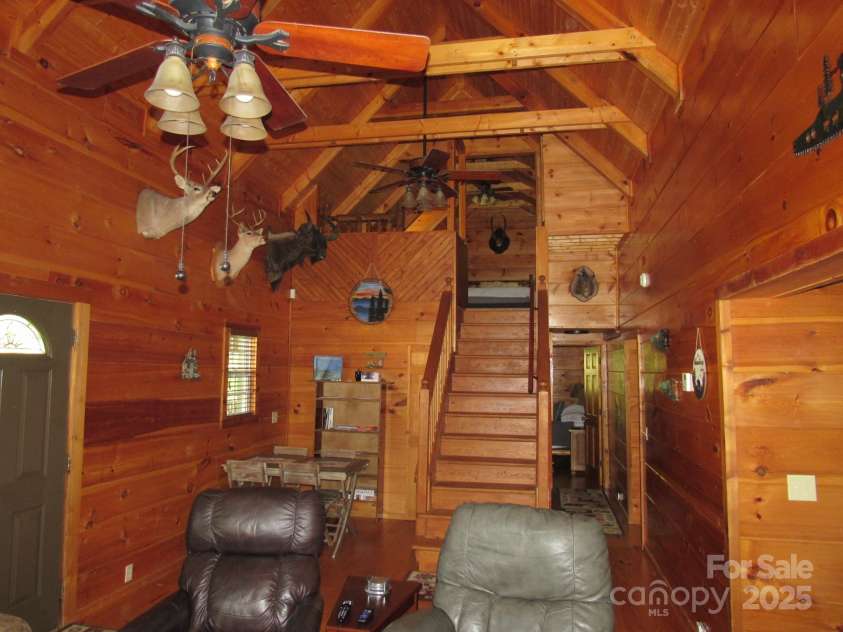 233 Rocky Top Road, Maggie Valley, NC 28751.  MLS# CAR4247300, YatesRealty ID 6543. Living room; another angle