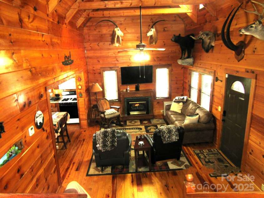 233 Rocky Top Road, Maggie Valley, NC 28751.  MLS# CAR4247300, YatesRealty ID 6543. Living room; as seen from upper level
