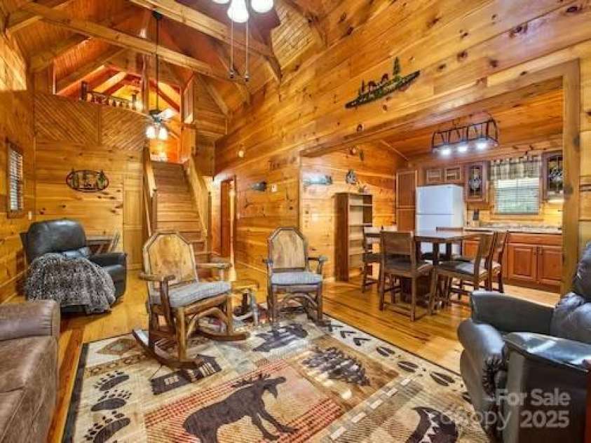 233 Rocky Top Road, Maggie Valley, NC 28751.  MLS# CAR4247300, YatesRealty ID 6543. Living room, kitchen, dining area