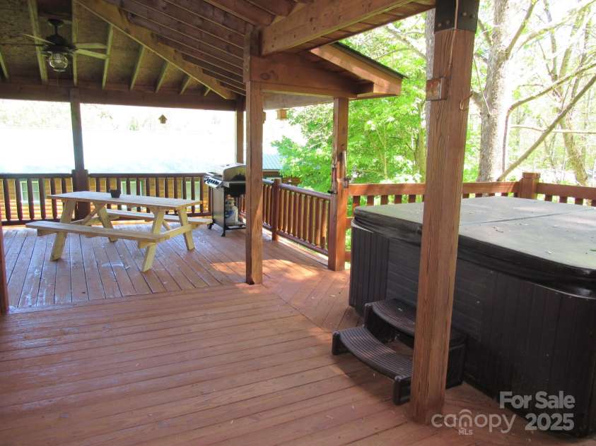 233 Rocky Top Road, Maggie Valley, NC 28751.  MLS# CAR4247300, YatesRealty ID 6543. Side porch with hottub