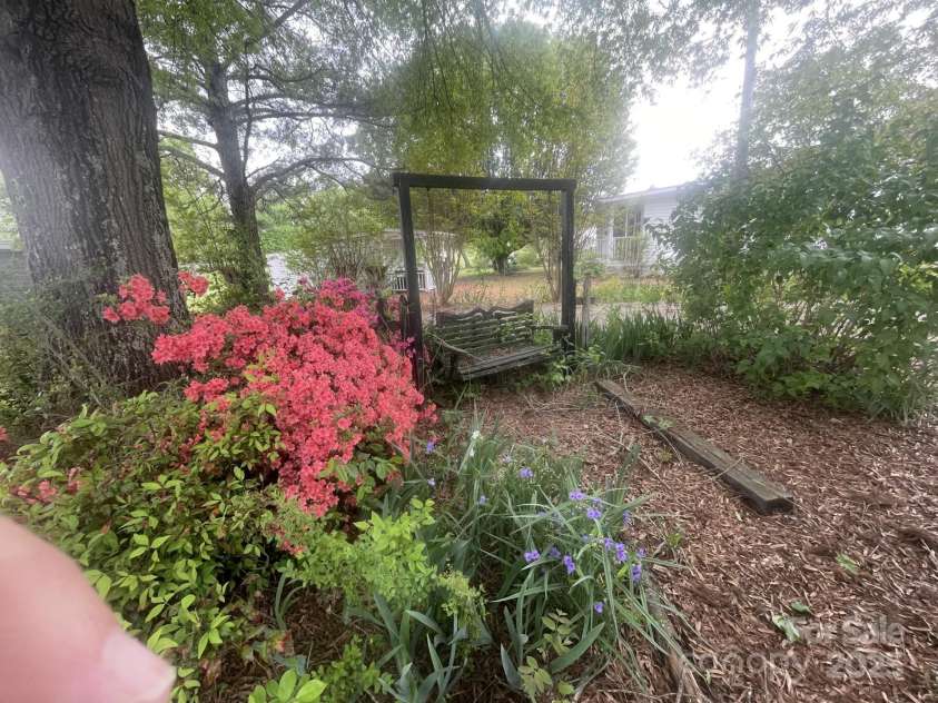 1620 Moss Springs Road, Albemarle, NC 28001.  MLS# CAR4248855, YatesRealty ID 6544. Side yard