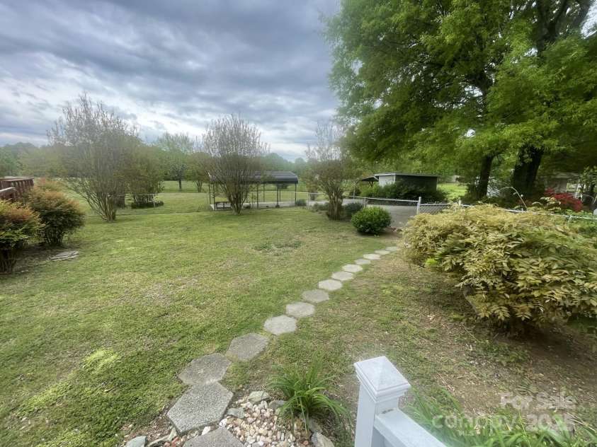 1620 Moss Springs Road, Albemarle, NC 28001.  MLS# CAR4248855, YatesRealty ID 6544. Walkway to the circular concrete driveway