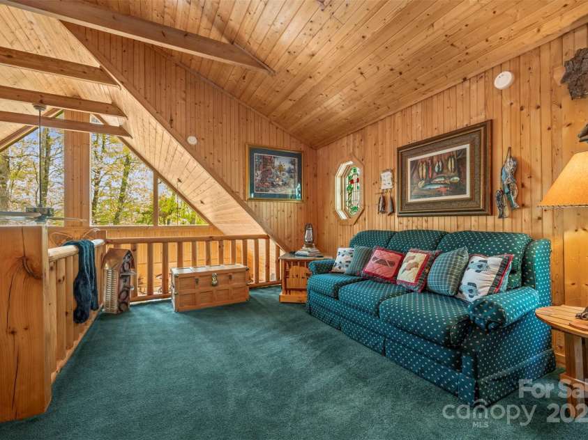 145 Flynn Court, Lake Lure, NC 28746.  MLS# CAR4247802, YatesRealty ID 6548. Loft area with a sleeper sofa