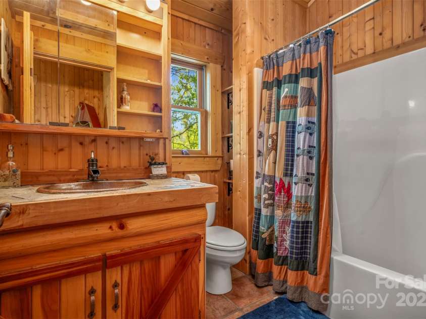 145 Flynn Court, Lake Lure, NC 28746.  MLS# CAR4247802, YatesRealty ID 6548. Loft Guest Bathroom