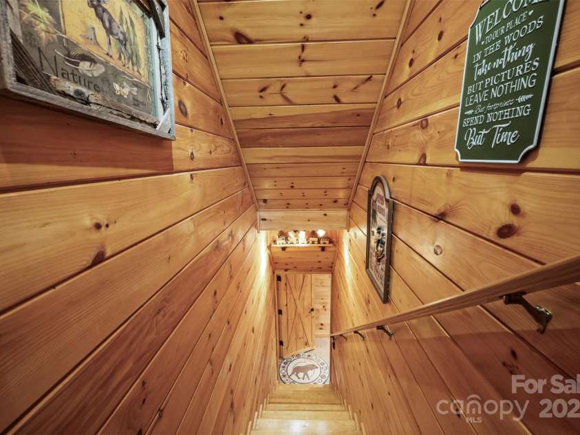 145 Flynn Court, Lake Lure, NC 28746.  MLS# CAR4247802, YatesRealty ID 6548. Stairs to the Basement