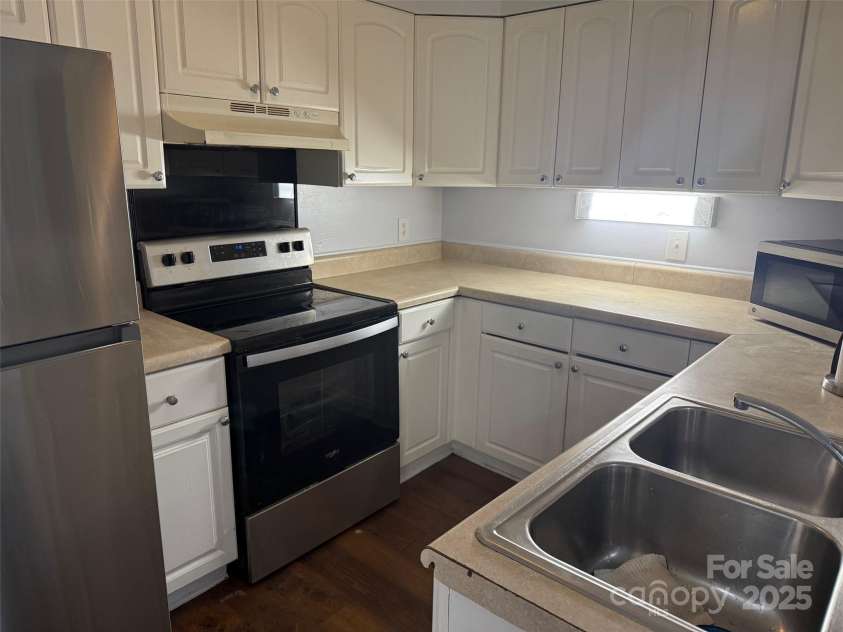 4823 Spring Lake Drive, Charlotte, NC 28212.  MLS# CAR4331709, YatesRealty ID 656. Kitchen near laundry closet