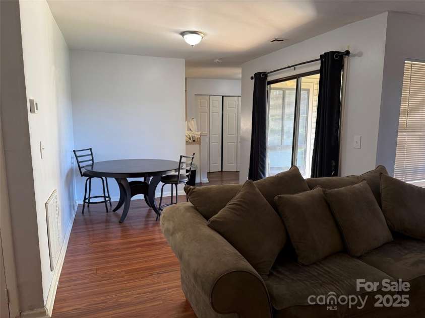 4823 Spring Lake Drive, Charlotte, NC 28212.  MLS# CAR4331709, YatesRealty ID 656. Living room open to dining